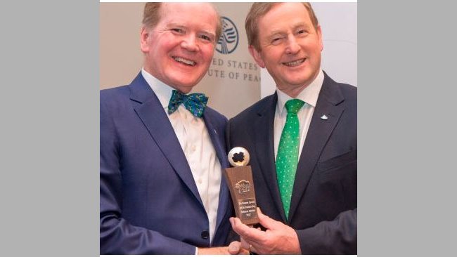 Taoiseach Enda Kenny (right) presents The Science Foundation Ireland St. Patrick's Day Science Medal 2017 to Dr. Pearse Lyons, president of Alltech, at the United States Institute of Peace. Photographed by Nick Crettier.