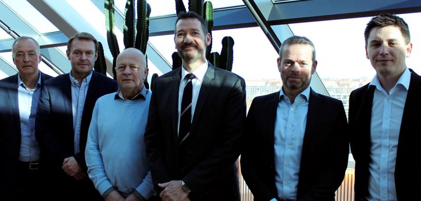 A satisfied group on the 19th of March following the sale of DK-Foods to Danish Crown and Tulip Food Company. From the left is seen Tulip&#39;s CFO Henrik Weihrauch, the board members Per Fischer Larsen and Steffen Ramsgaard from DK-Foods, Tulip&#39;s CEO Kasper Lenbroch, partner Per H&oslash;holt from May Invest Equity and Kasper Orloff, who is the VP Corporate Secretary at Danish Crown.
