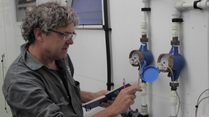 Tim Miller checks the calibration on of water meters on a Midlands pig farm.

