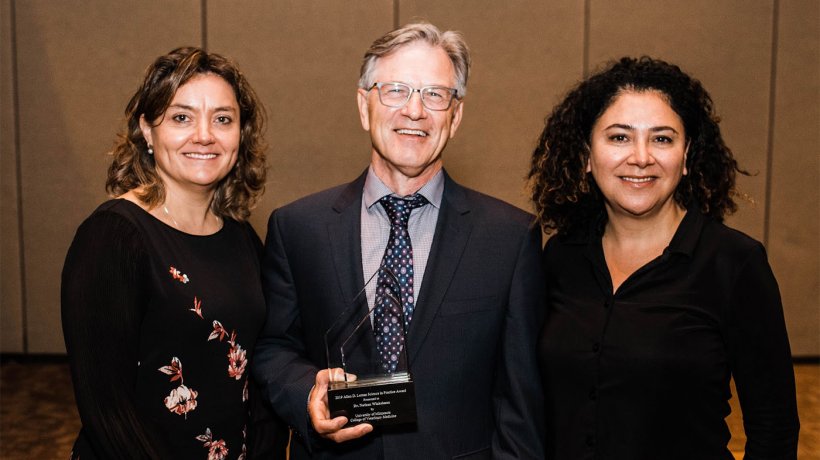 Dr. Nate Winkelman with Dr. Montse Torremorell, UMN (left) and Dr. Lucina Galina, Zoetis (right)
