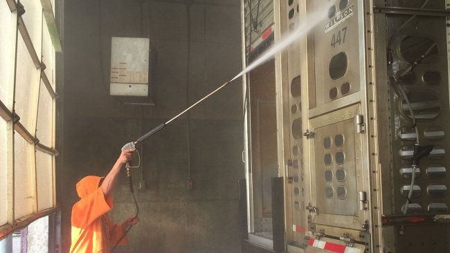 Photo 2. Power washing of a truck exterior.