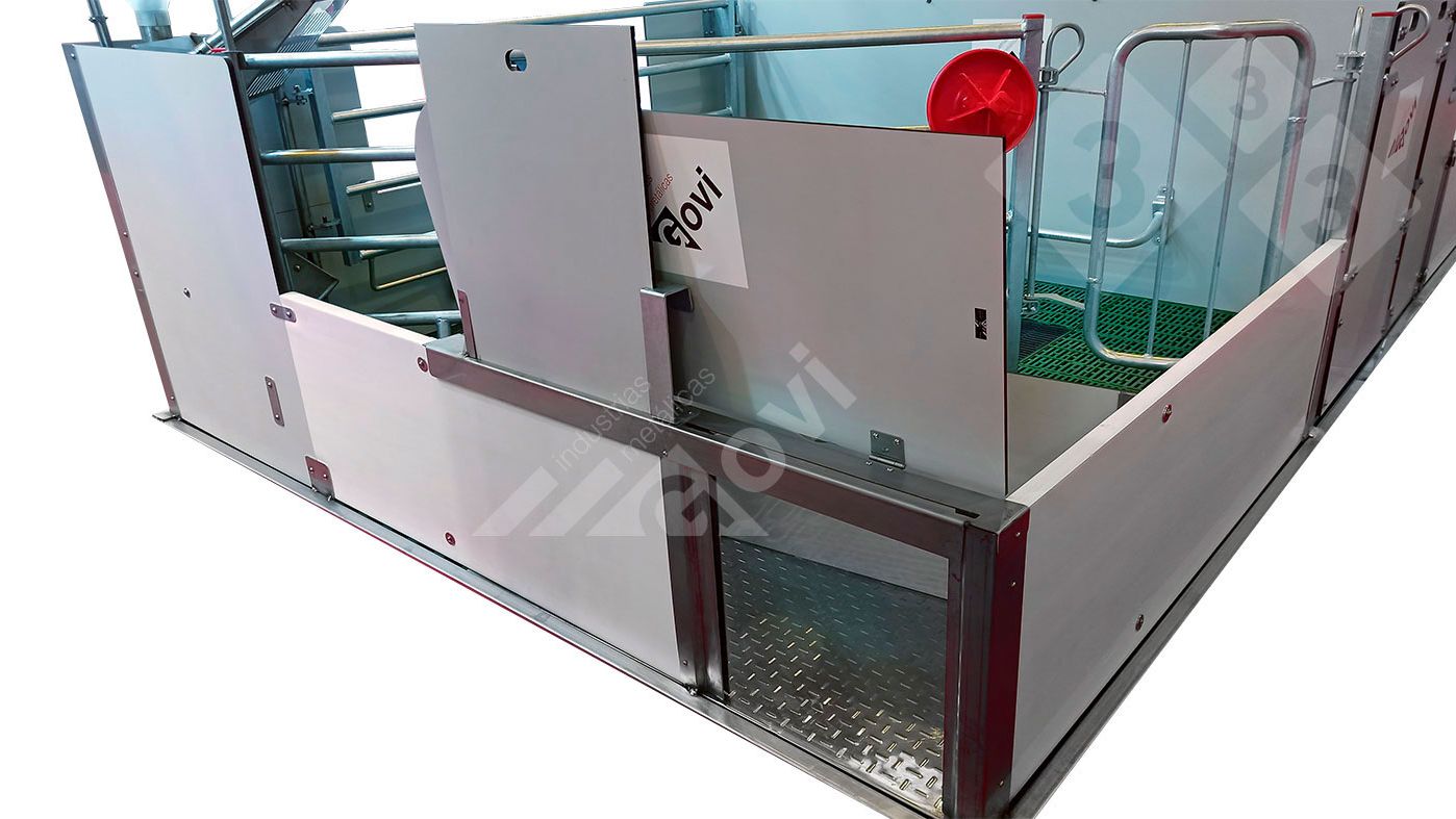 Figure 1. Farrowing pen&nbsp;with doors that give&nbsp;piglets access to the neighboring nesting area or pen.
