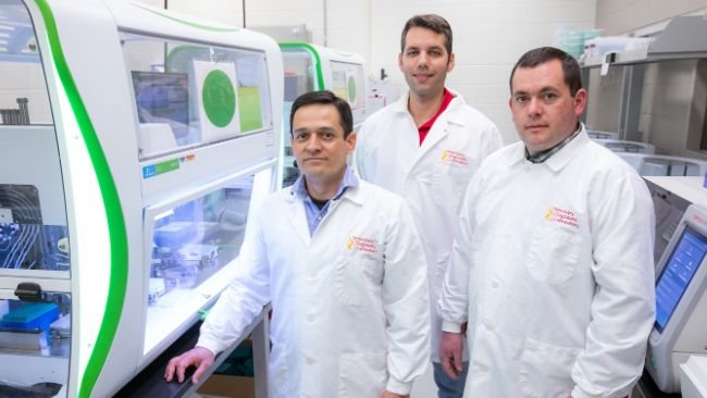 The Swine Disease Reporting System is managed by ISU faculty and graduate students in veterinary diagnostic and production animal medicine, including from left, associate professor Daniel Linhares, graduate student Guilherme Cezar and research assistant professor Giovani Trevisan, in a lab inside the Veterinary Diagnostic Lab. Photo by Christopher Gannon/Iowa State University.