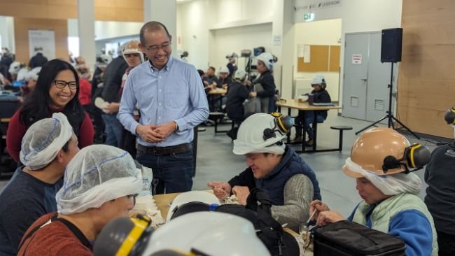 Sangfai connecting with Neepawa employees during break.