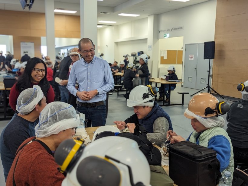 Sangfai connecting with Neepawa employees during break.