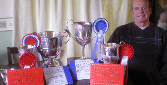 Ian Broumpton with the haul of silverware which he  won at Hull Market Christmas Fatstock Show