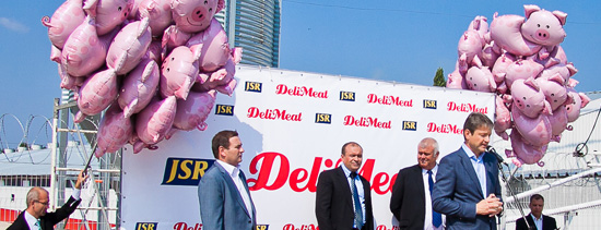 Paul Anderson of JSR with dignitaries at the Delimeat Farming Complex opening
